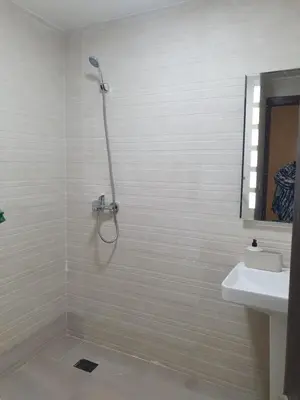 a bathroom with a shower and a sink at Dar diafa in Imouzzer Kandar