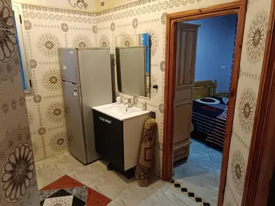 a bathroom with a sink and a mirror at Appartement Aboumalik in Agdz