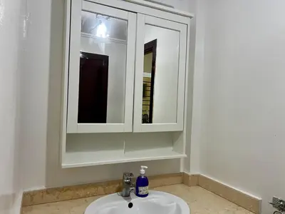 a bathroom with a sink and a mirror at Luxury appartement centre ville fes in Fès