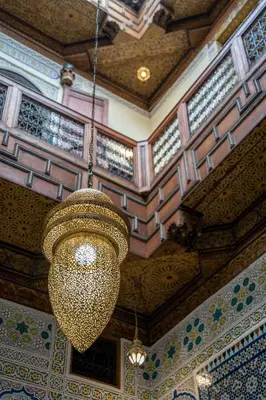a large chandelier hanging from the ceiling of a building at Dar Na in Station Bab Ftouh