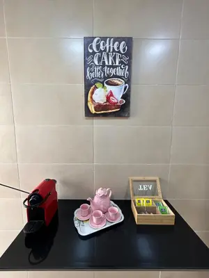 a table with a coffee maker and a tea pot at Modern apartment near amenities in Fès
