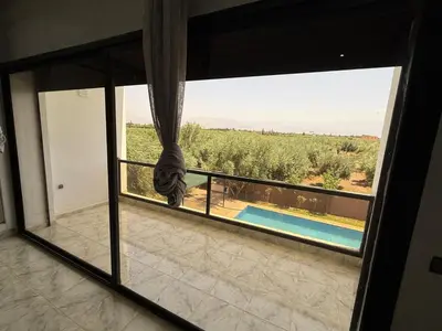a room with a window with a view of a field at Villa Adam in Srarhna
