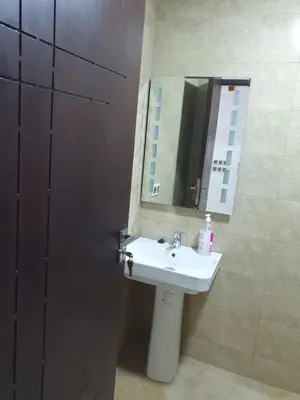 a bathroom with a sink and a mirror at Dar diafa 2 in Imouzzer Kandar