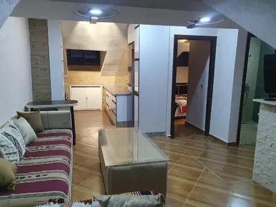 a living room with a couch and a table at Dar diafa 2 in Imouzzer Kandar
