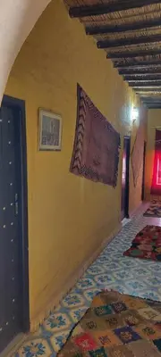 a room with a wall with a flag on it at hostel sable dor merzouga in Merzouga