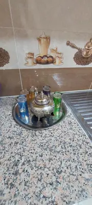a tray with a tea set on a counter at Superbe appartement de luxe in Fès