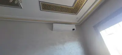 a room with a ceiling with a air conditioner at Superbe appartement de luxe in Fès