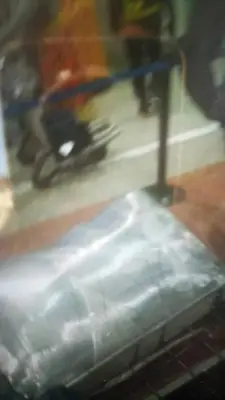 a blurry picture of a table with a chair in a room at Fes in Fès