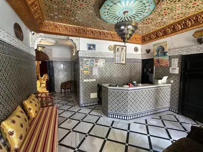 a large room with a tile floor and a ceiling at Riad Fes Bab Rcif Suite &Spa in Fès