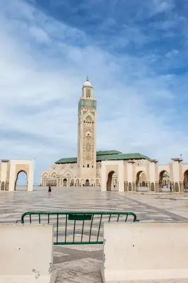 a large building with a clock tower in a courtyard at Marokkoreizen in Fès