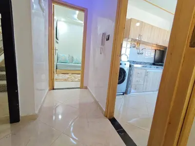 a hallway of a kitchen with a door open at Dar Ines in Midelt