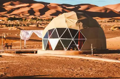 a dome tent in the middle of the desert at Quiet Luxury Camp in Merzouga
