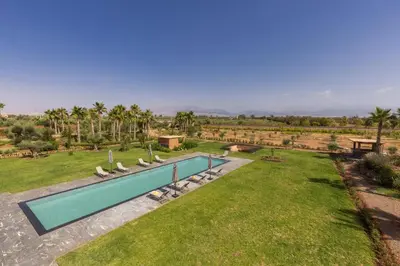 an image of a swimming pool in a yard at Villa Dar Tillili Marrakech in Heddad