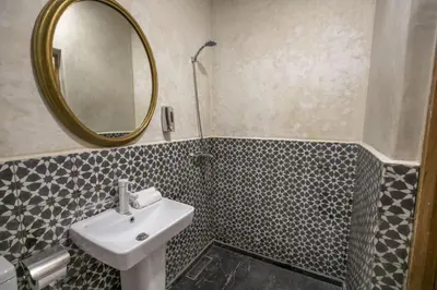 a bathroom with a sink and a mirror at Dar Mima in Fès