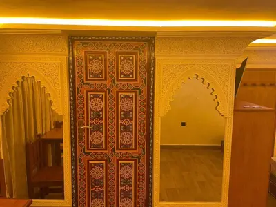 a wooden door with an ornate design on it at Entire place Medina's Home in Fès