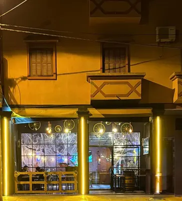 a restaurant with lights in front of a building at Bel appartement familial au centre ville in El Kelaa des Srarhna