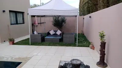 a gazebo in the backyard of a house at Villa jama in Marrakech