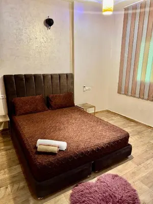 a bedroom with a bed with two towels on it at Apartment, well equipped in Fès