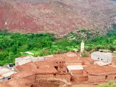 an aerial view of a village with a mountain at Refuge Comfort and Rustic Charm in Anammer