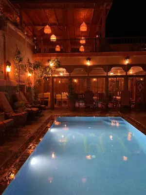 a large swimming pool in the middle of a building at Ecolodge Dar itran in Azilal