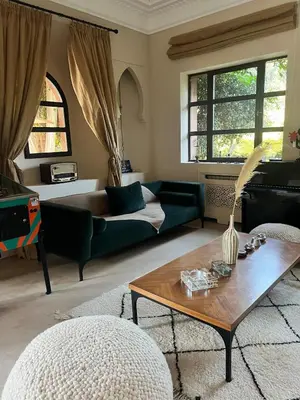 a living room with a couch and a coffee table at Luxury Villa Marrakech - Heated Pool in Najem