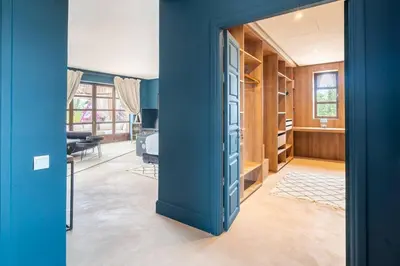 a room with a blue door and a living room at Luxury Villa Marrakech - Heated Pool in Najem