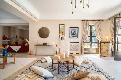 a living room with a table and a couch at Luxury Villa Marrakech - Heated Pool in Najem