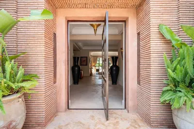 a mirror on the side of a building with vases at Luxury Villa Marrakech - Heated Pool in Najem