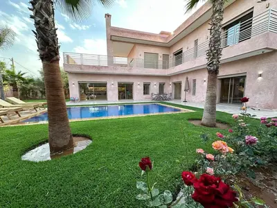 a house with a swimming pool in a yard at Villa Bellevue Marrakech in Sbiti