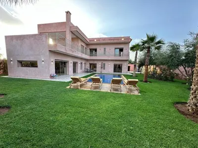 a house with a swimming pool in the yard at Villa Bellevue Marrakech in Sbiti
