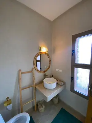 a bathroom with a sink and a mirror at Villa Bellevue Marrakech in Sbiti