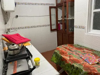 a small room with a room with a bed and a bathroom at شقة للكراء اليومي in Azrou