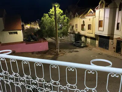 a view of a street from a balcony at night at شقة للكراء اليومي in Azrou