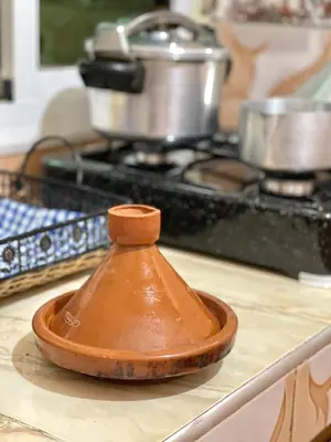 a wooden bowl sitting on top of a kitchen counter at Red Stone Appartement in Midelt