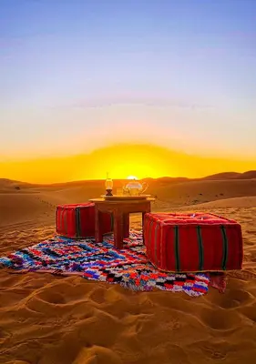 a table in the middle of the desert at Tipic luxury camp in Merzouga
