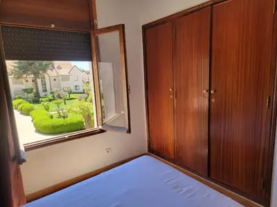 a bedroom with a large window and a bed at Chalet Haut standing pour les familles seulement in Ifrane
