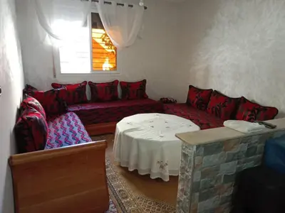 a living room with a couch and a table at Appartement Hamza in Azrou