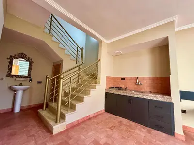 a bathroom with a sink and a staircase at Complexe Kariat Ayoub in Aït Zat