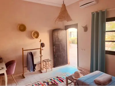 a room with a door leading to a patio at Hacienda Joud Marrakech-Safi in Ben Bouih