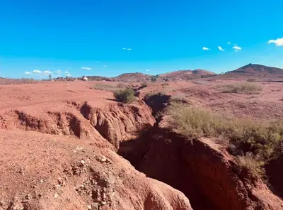 a view of the desert with mountains in the background at Hacienda Joud Marrakech-Safi in Ben Bouih