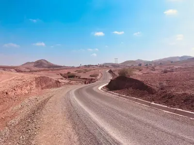 an empty road in the middle of a desert at Hacienda Joud Marrakech-Safi in Ben Bouih