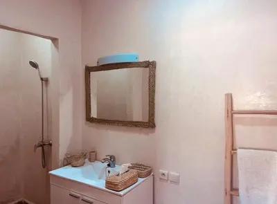 a bathroom with a sink and a mirror on the wall at Hacienda Joud Marrakech-Safi in Ben Bouih
