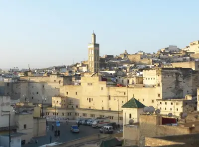 a view of a city with a clock tower at Dar Essoaoude - Fes Nejjarine in Fès