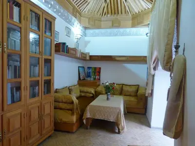 a living room with a couch and a table at Dar Essoaoude - Fes Nejjarine in Fès