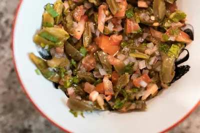 a bowl of food with vegetables on a plate at Olecactus in Gourrama