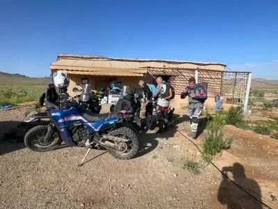 a group of people standing next to a motorcycle at Olecactus in Gourrama