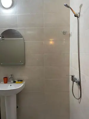 a bathroom with a shower and a sink at Dyafat Abla in Ouarzazate