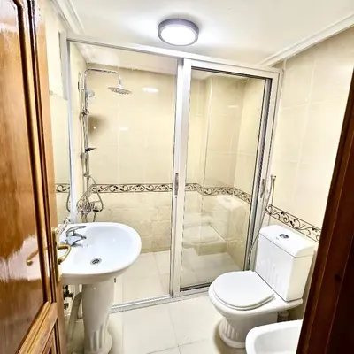 a bathroom with a shower and a toilet and a sink at Appartement centre-ville avec Wifi fibre optique in Fès