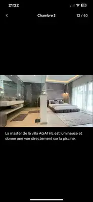 a page of a website with a room with beds at Villa avec piscine chauffée in Marrakech