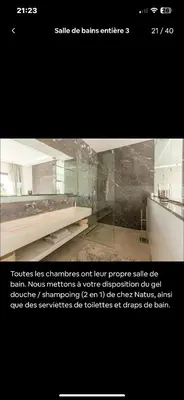 a picture of a room with a glass wall at Villa avec piscine chauffée in Marrakech